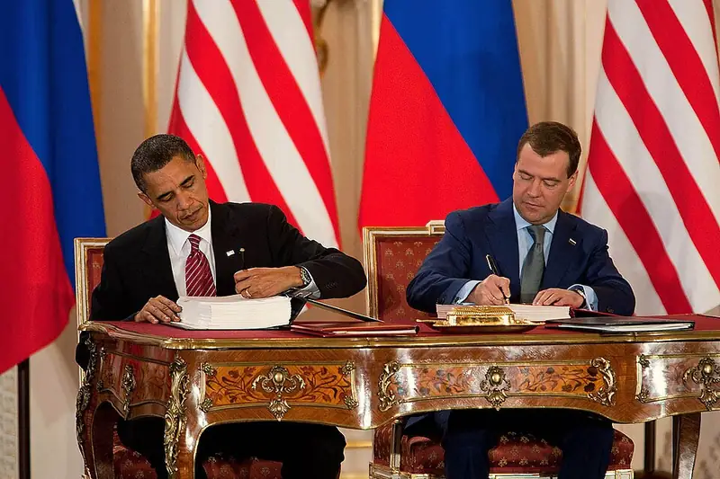 President Obama and President Medvedev sign New START in Prague.